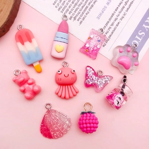 DIY mixed resin pendants including candy, bear, and lipstick shapes for jewelry making