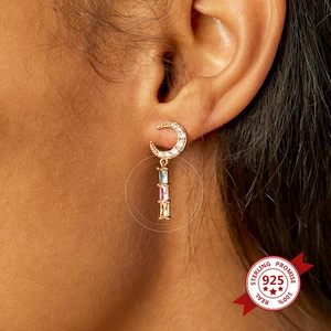 925 silver crescent moon drop earrings with colorful zircon crystals on a model