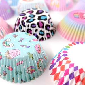 Close-up of assorted printed greaseproof paper muffin cups with vibrant patterns