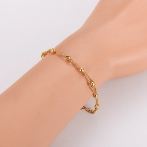 Double-layered gold beaded bracelet for women in minimalist stainless steel jewelry design