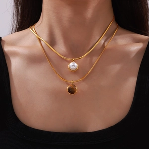Elegant gold double layer snake chain necklace with pearl and tiger eye stone pendants