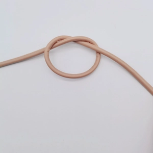 Macro detail of knotted 6mm beige faux leather cord for bags and clothing accessories