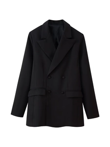 Detailed flat lay of a black double-breasted blazer with peaked lapels and flap pockets