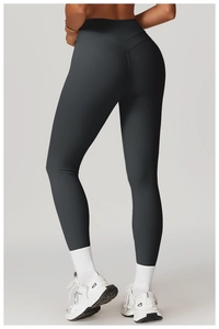Detail of high waisted dark grey yoga leggings with V-shaped back seam for butt lifting