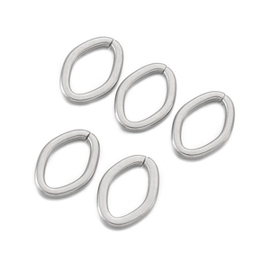 Five silver stainless steel oval jump rings for DIY jewelry making on white background