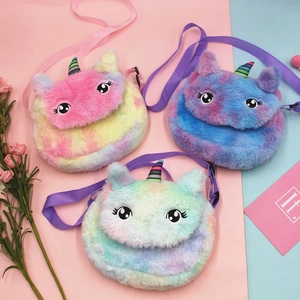 Three colorful plush unicorn crossbody bags with rainbow horns and adjustable straps