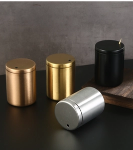 Detailed view of stainless steel toothpick holders in gold, silver, and matte black finishes