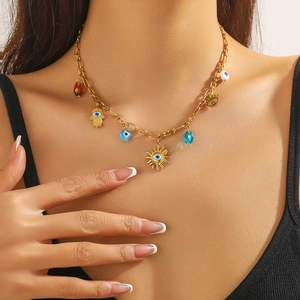 Bohemian gold stainless steel necklace with evil eye and hand of Fatima pendants
