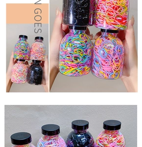 Detail of high-elastic disposable hair bands in a transparent bottle for easy storage