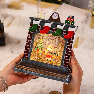 Red brick fireplace Christmas snow globe featuring Santa Claus and swirling glitter