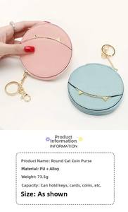 Detail view of pink and blue round cat-shaped coin purses with gold chain and lobster hook