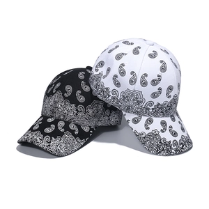 Unisex paisley print baseball caps in black and white with curved brims for streetwear fashion