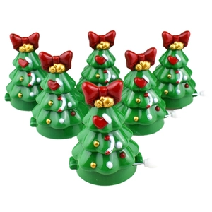 Detailed set of green wind-up walking Christmas tree toys with red bows and festive ornaments