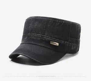 Detail of vintage washed denim flat top cap with metal logo plate and side air vents