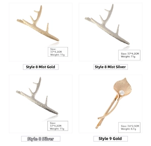 Detailed view of antler and calla lily metal hair clips with pearl accent and matte finish
