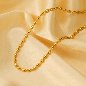 Elegant 18K gold plated oval bead chain necklace displayed on smooth champagne satin fabric