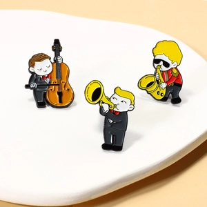 Cartoon enamel pin set featuring cello, trumpet, and saxophone musicians in bright colors