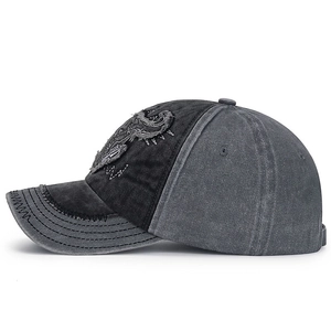 Vintage washed cotton baseball cap with dragon embroidery and distressed raw edge details