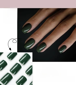 Detail view of dark green solid color press-on nails with finger wearing effect demonstration