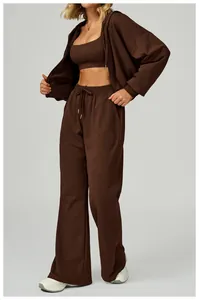 Detail of dark brown zip-up hoodie set with drawstring waistband and high-quality fabric