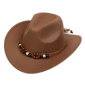 Detailed view of the beaded ethnic band on a brown felt Western cowboy hat