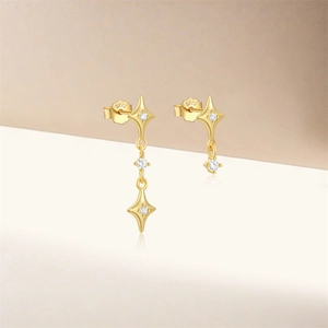 Close-up of S925 sterling silver gold star earrings with clear stones and S925 hallmark
