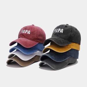 Detailed stack of multi-color washed cotton baseball caps with PAPA embroidery detail