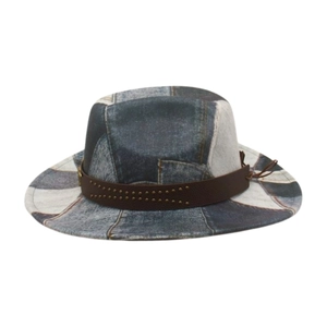 Detailed texture of patchwork denim fedora with brown studded leather hatband detail