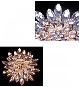 Detailed close-up of crystal sunburst brooches in silver and gold metal finishes