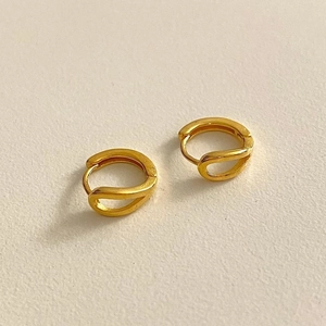Minimalist double interlocking golden hoop earrings with a matte textured finish
