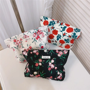 Three-piece floral cotton makeup bags set with vintage rose and tulip patterns