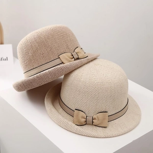 Breathable straw sun hat with ribbon bow and curled brim for elegant summer protection