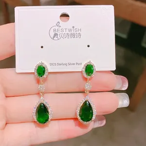 Vintage French emerald green tassel earrings with gold plating and cubic zirconia accents