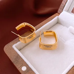 Minimalist square gold plated earrings with brushed texture and luxury engraved details