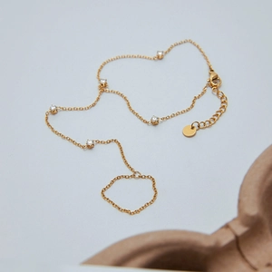 Elegant gold zircon hand harness bracelet with five crystals and connecting finger ring link