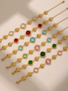 Detail of colorful faceted glass bracelets with gold beads and adjustable lobster clasp