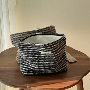 Detail of simple wish woven pouches showing thick textured fabric and interior space