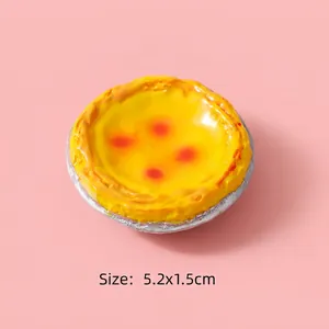 Detailed size view of a realistic 5.2x1.5cm resin egg tart toy model on pink background