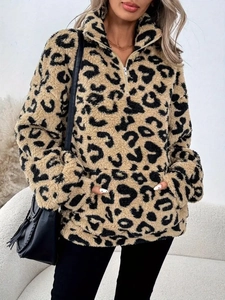Detail of leopard print teddy fleece texture on women's half-zip pullover hoodie