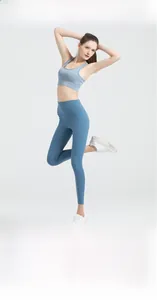 Detail view of high-waist light blue yoga leggings with functional side pockets and seams