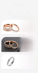 Detail showing rose gold and silver sparkling pavé set stacking rings for couples