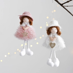 Detail of plush Christmas angel dolls with feather skirts and sequin star charms
