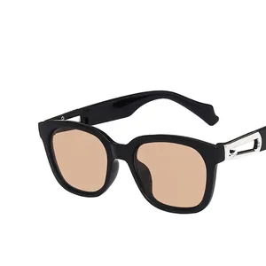 Square black frame sunglasses with light brown lenses and silver hollow metal temple detail