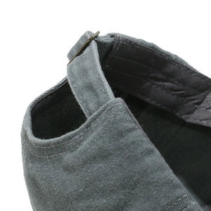 Detail of adjustable metal buckle and stitching on vintage washed cotton baseball cap