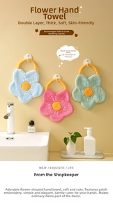 Detail of flower-shaped hanging hand towels in blue, pink, and green thickened coral fleece