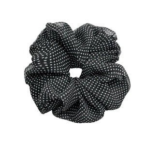 Chiffon mesh scrunchie with white polka dots on black background for women's hair styling