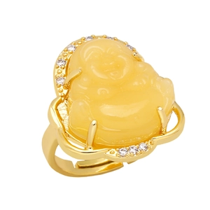 Detail of Laughing Buddha ring featuring a yellow resin stone and gold-plated band