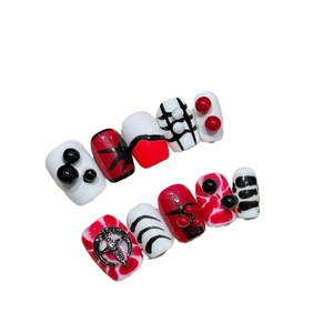 Gothic punk press-on nails with 3D beads and silver star charms in red and black