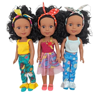 Detailed trio of African baby dolls in vibrant colorful outfits and curly hair