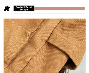 Close-up of the durable canvas texture and reinforced double-stitched seams on the bag